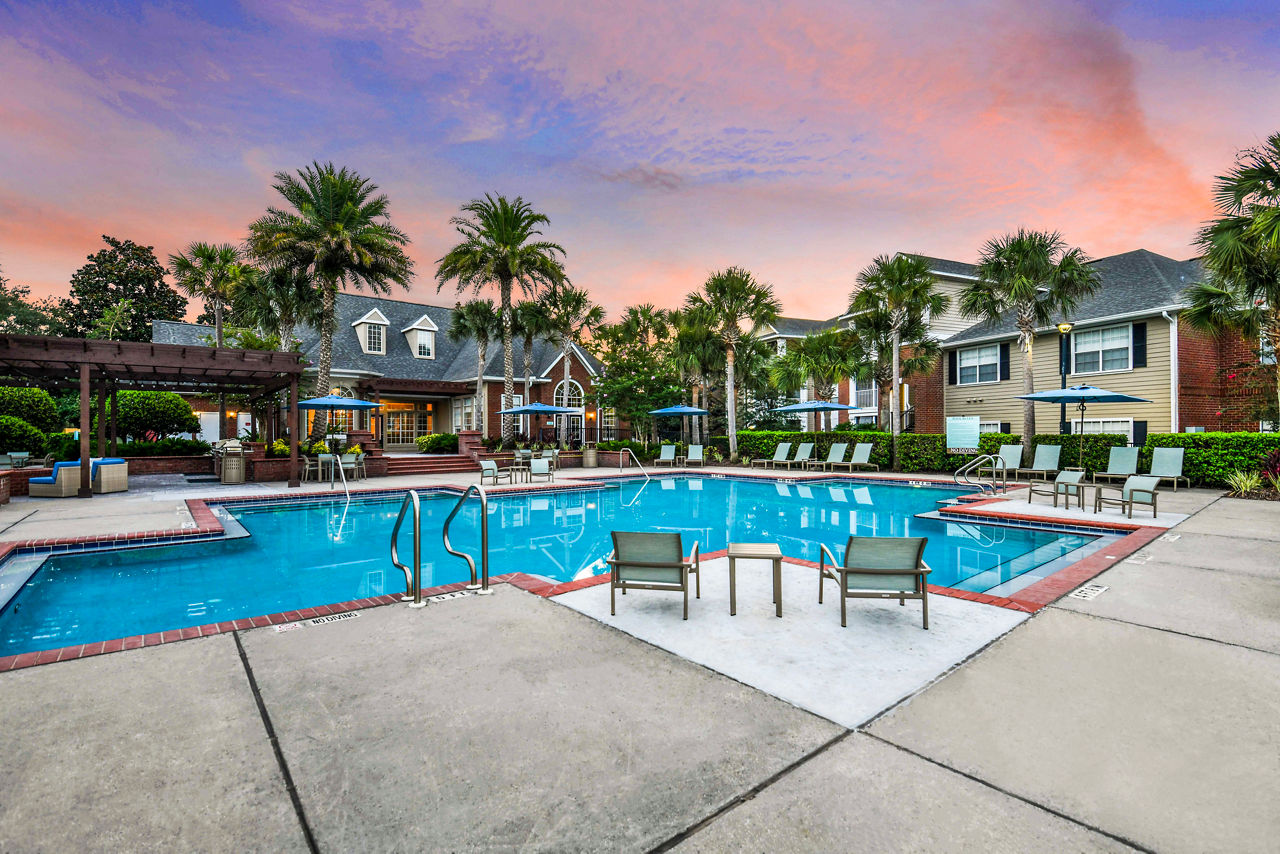 Rooftop pool with lounge chairs at 54 Magnolia Apartments, a Greystar luxury apartment community