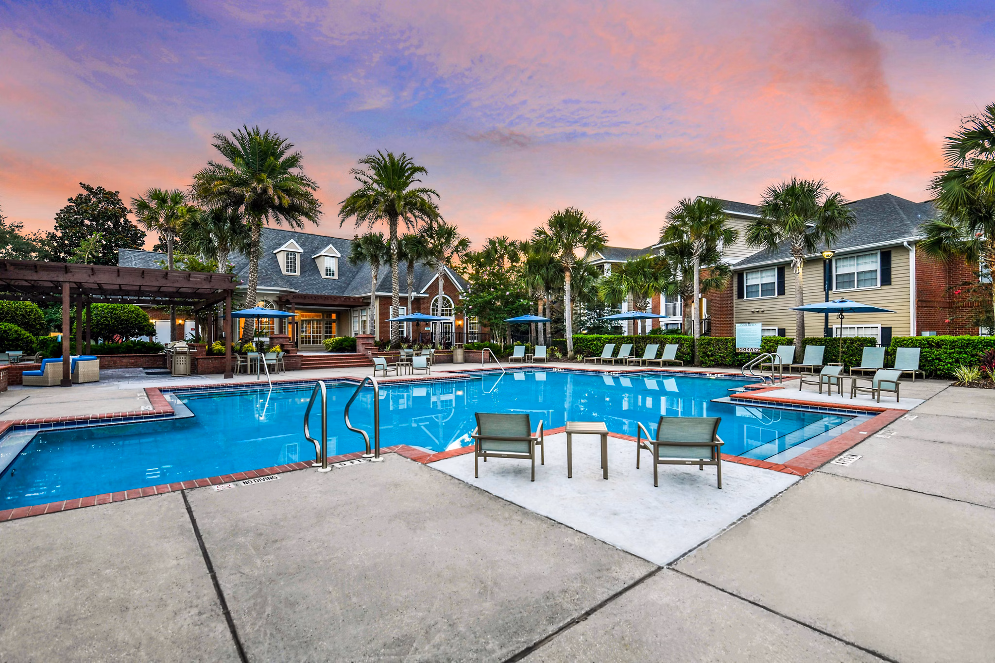 Rooftop pool with lounge chairs at 54 Magnolia Apartments, a Greystar luxury apartment community