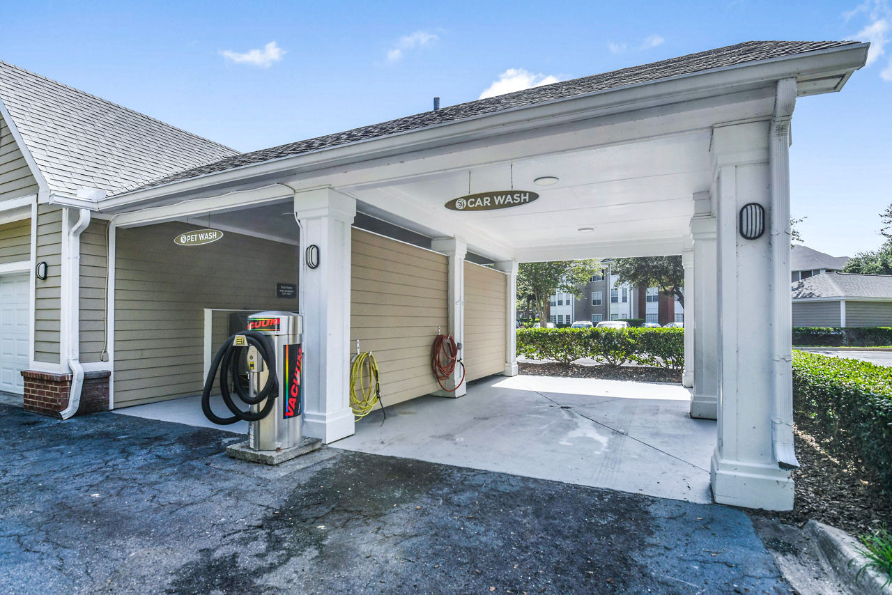 Convenient car washing station at 54 Magnolia Apartments, luxury living by Greystar