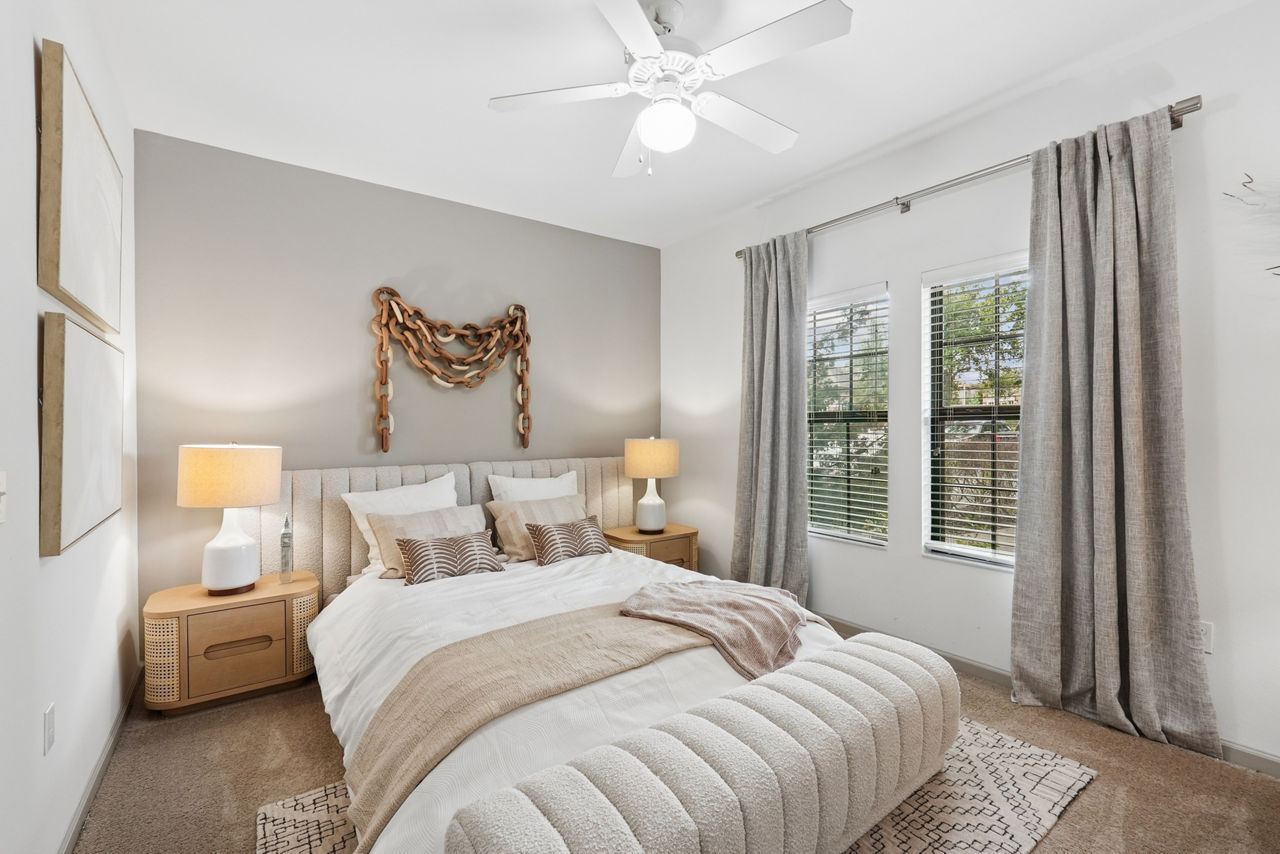 Cozy bedroom with elegant decor at Sanctuary at Eagle Creek Apartments