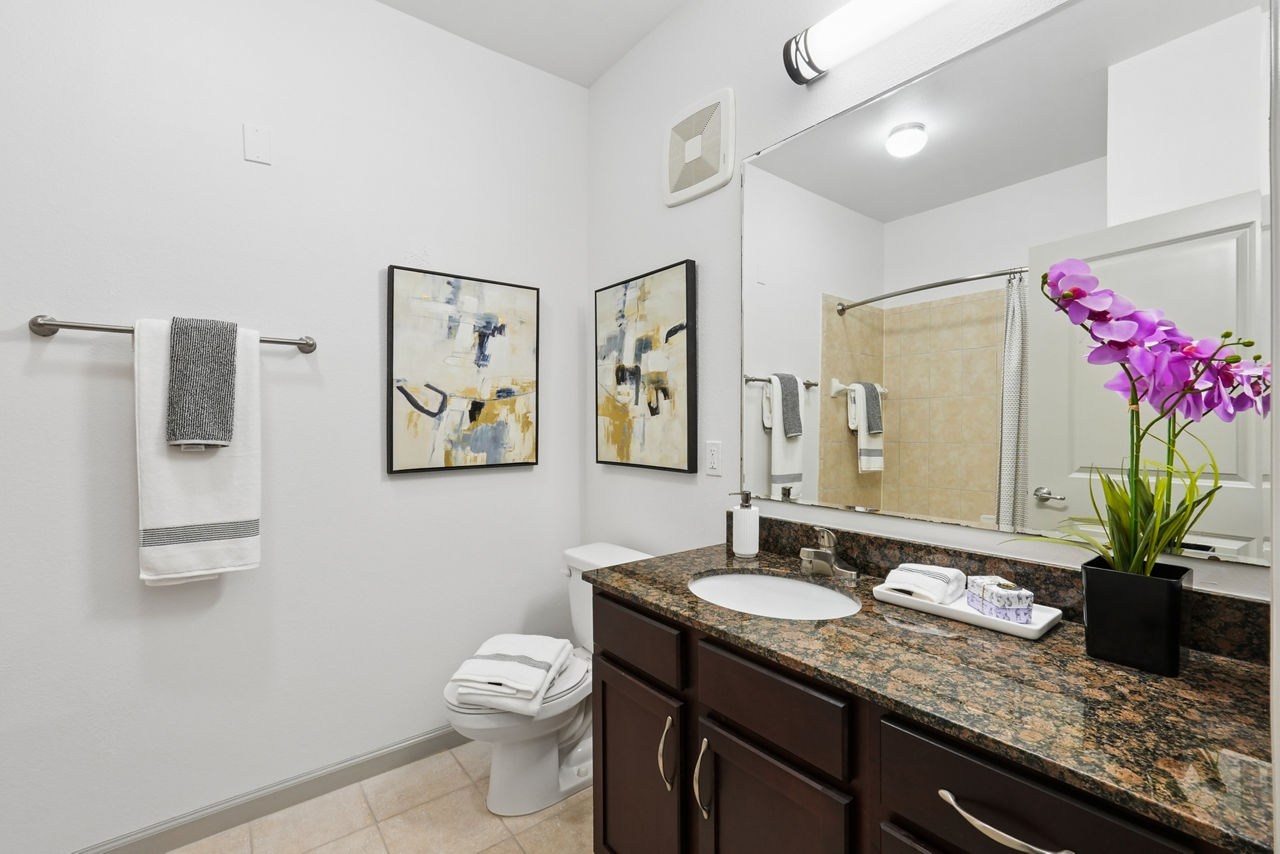 Luxurious bathroom with marble countertops at Sanctuary at Eagle Creek Apartments