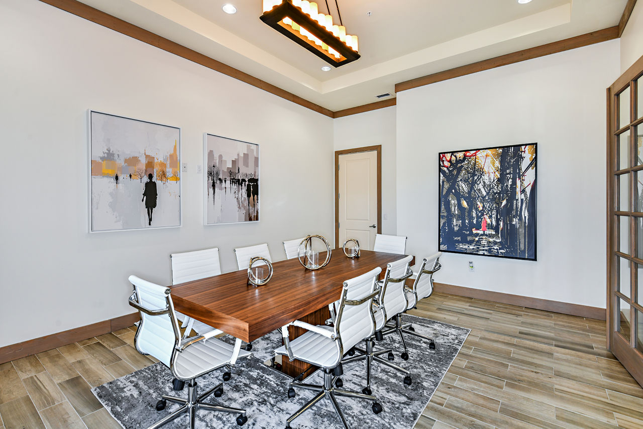 Stylish clubhouse at Sanctuary at Eagle Creek Apartments featuring modern design and comfortable seating areas