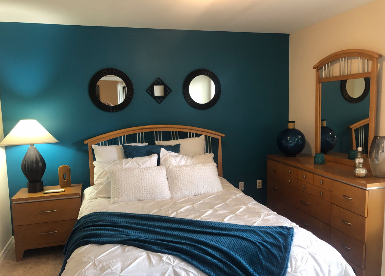 Cozy bedroom with modern decor at Stonebrook Apartments, a Greystar luxury residence, perfect for comfort and style in urban living