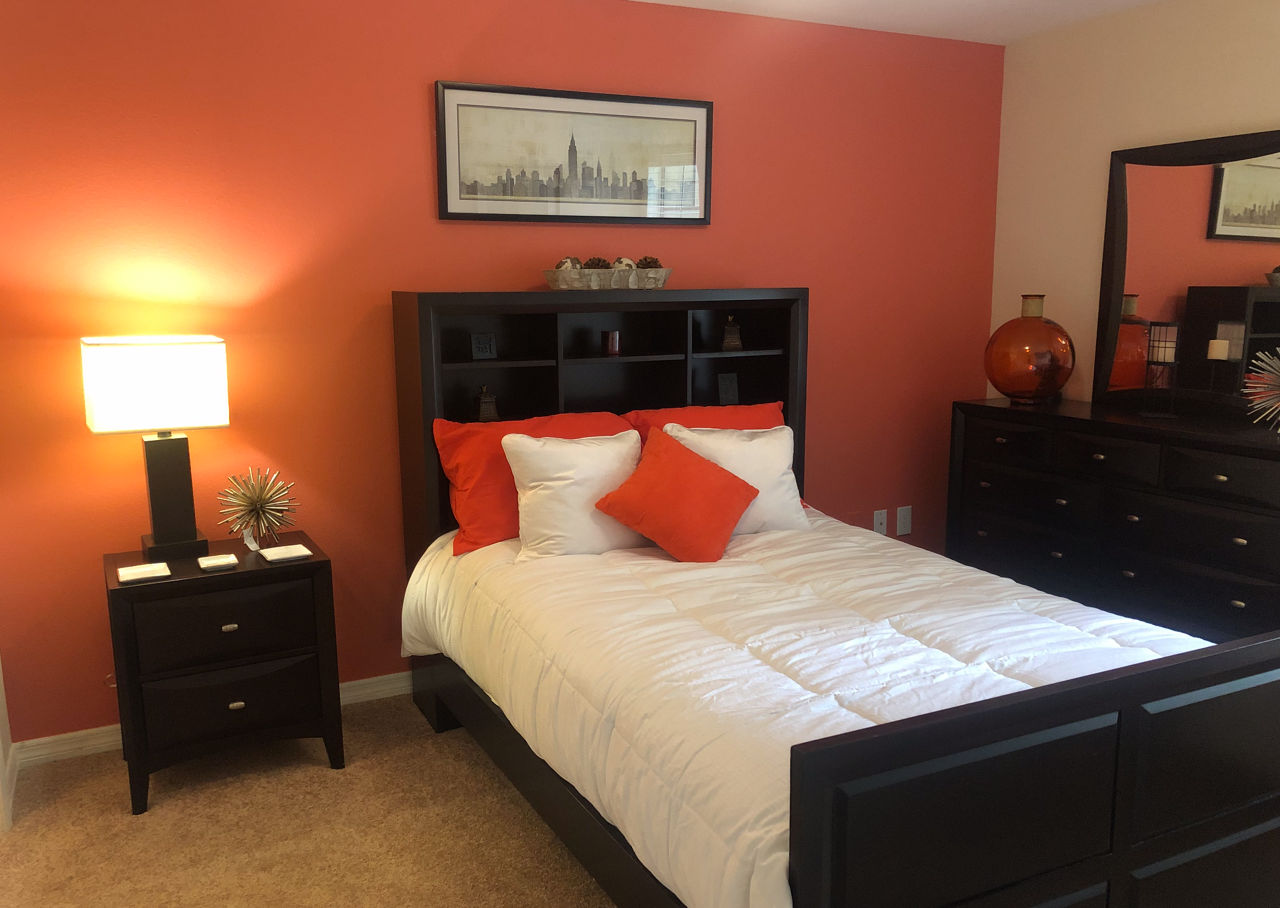 Cozy bedroom with modern decor at Stonebrook Apartments: Luxurious living spaces for comfort and style