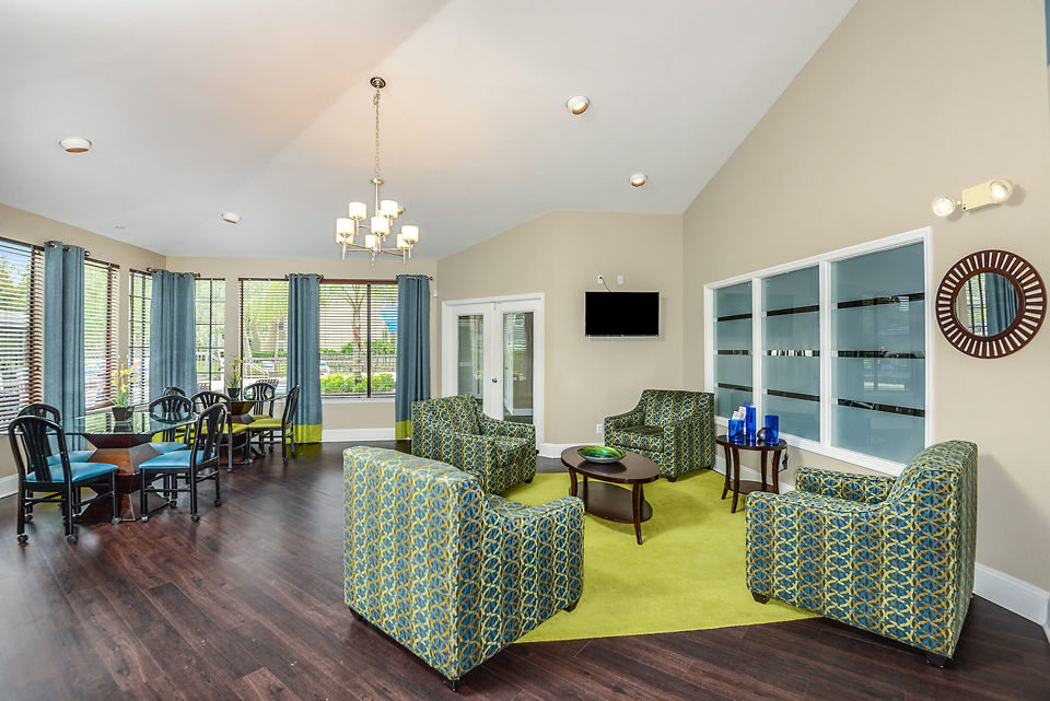 Clubhouse with modern furnishings at Stonebrook Apartments featuring luxury amenities and gathering spaces for residents