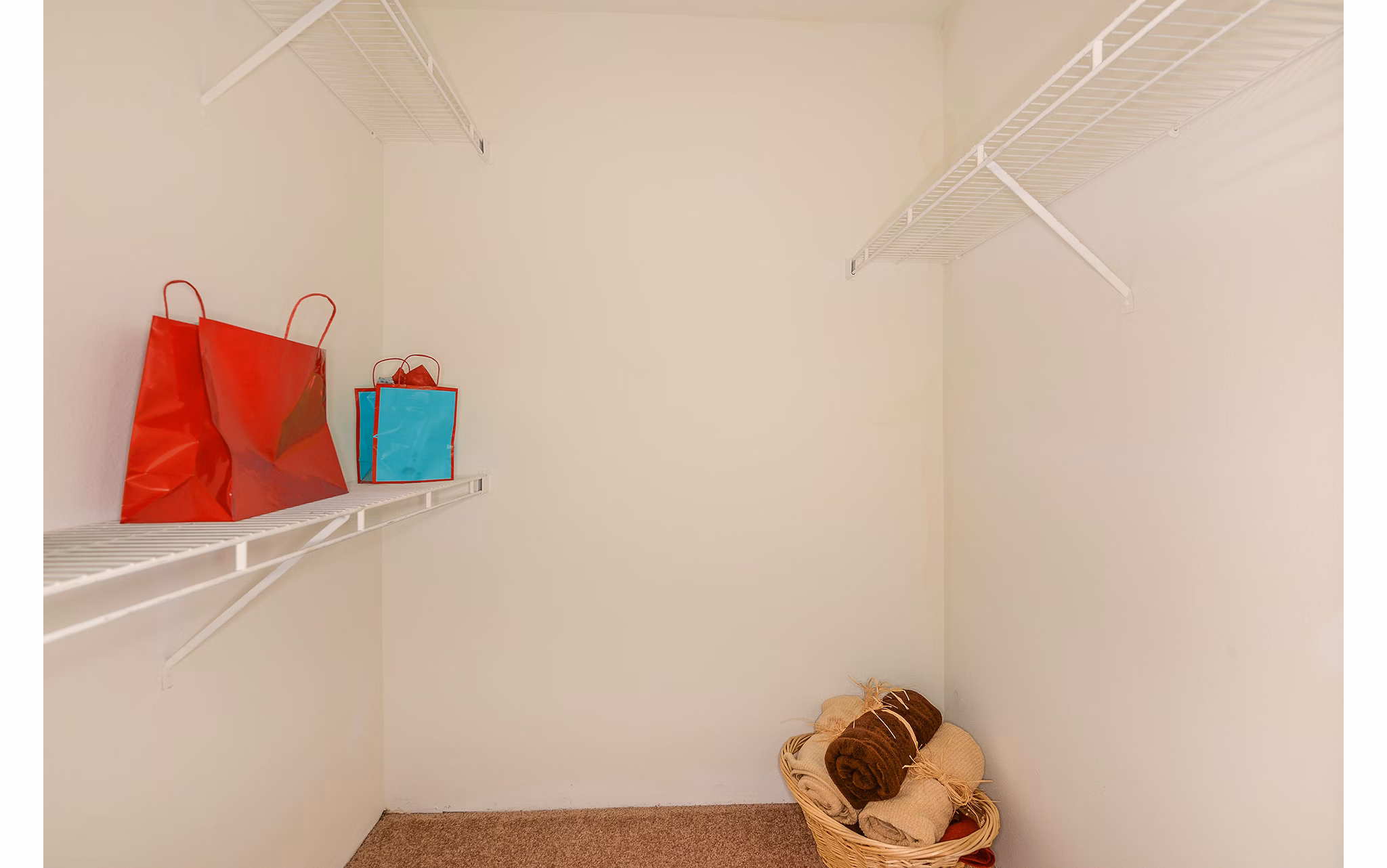 Walk-in closet with ample storage space in Stonebrook Apartments
