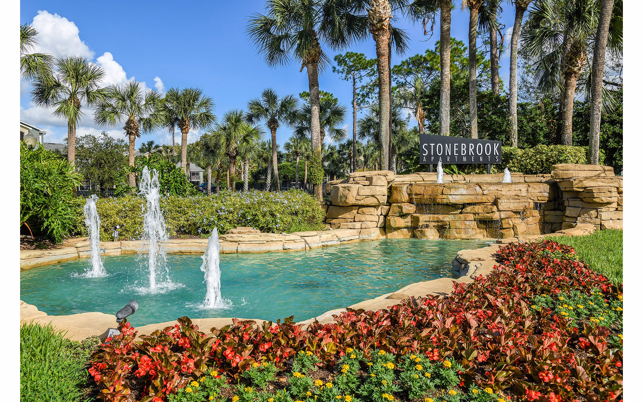Stonebrook Apartments: Scenic view of luxury apartments nestled in landscaped surroundings