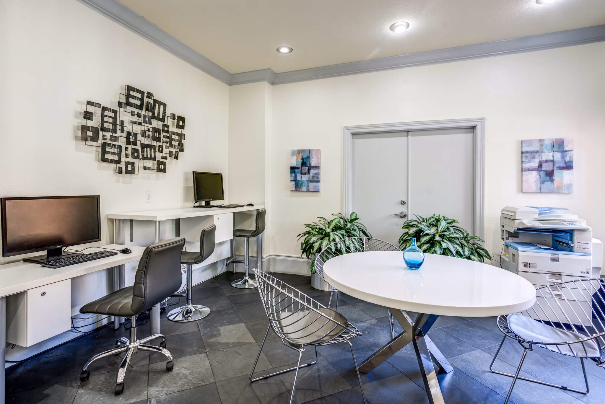 Business center featuring modern workspaces at Park Central Apartments - Manor Row