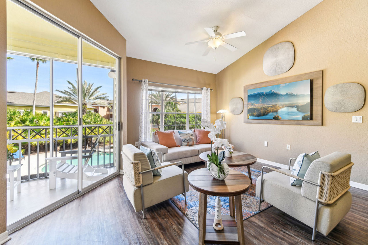 Spacious living room with modern decor at Park Central Apartments - Manor Row, offering luxury and comfort
