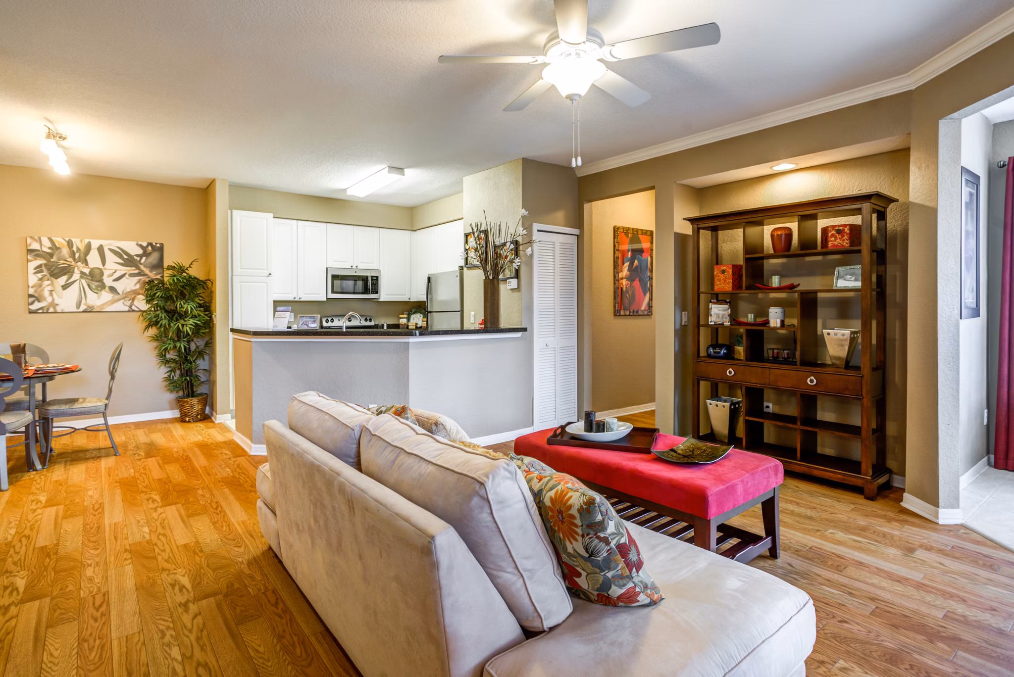 Spacious living room with modern decor at Park Central Apartments - Manor Row, offering luxury and comfort