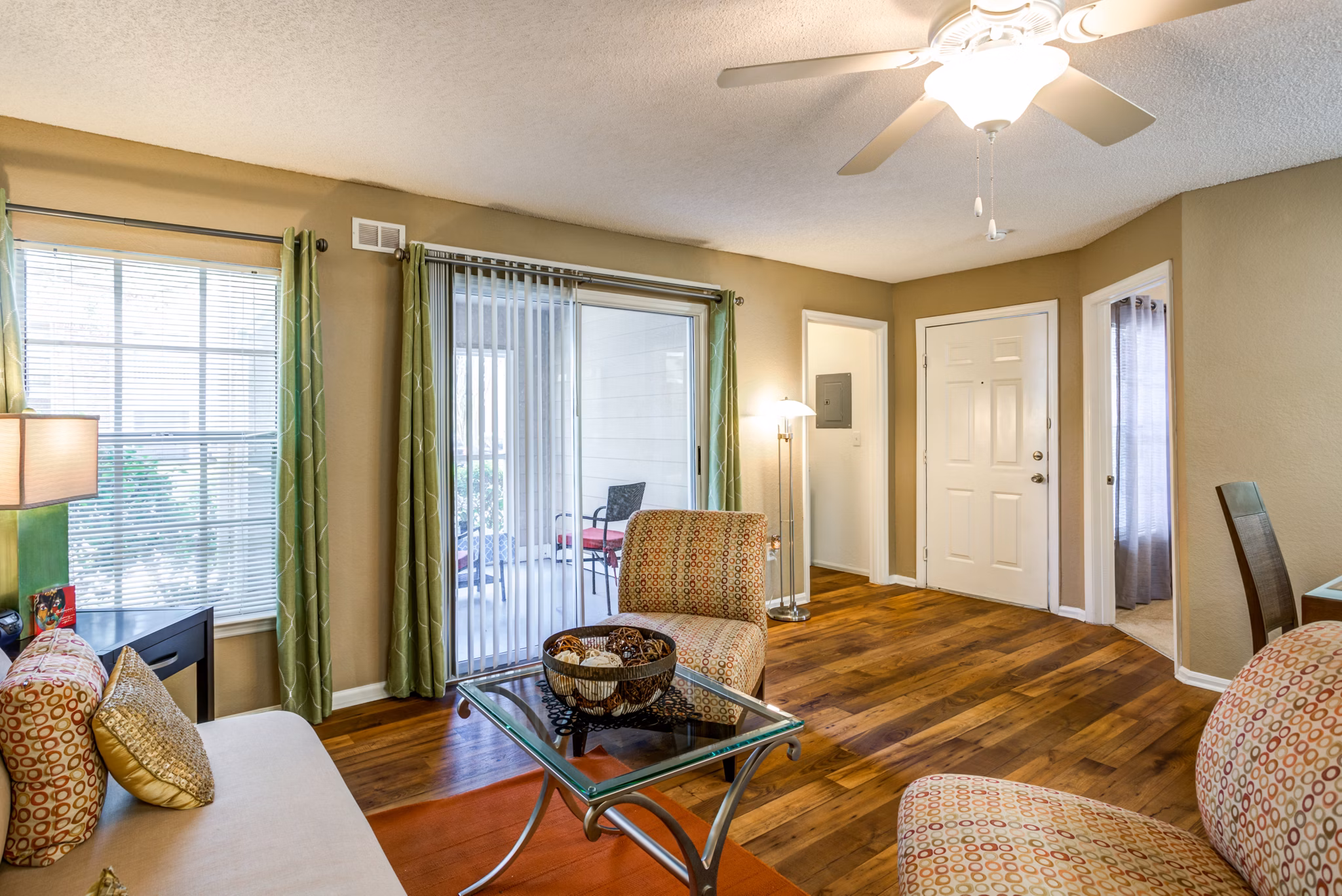 Cozy living room with modern decor and natural lighting at Park Central Apartments, Manor Row
