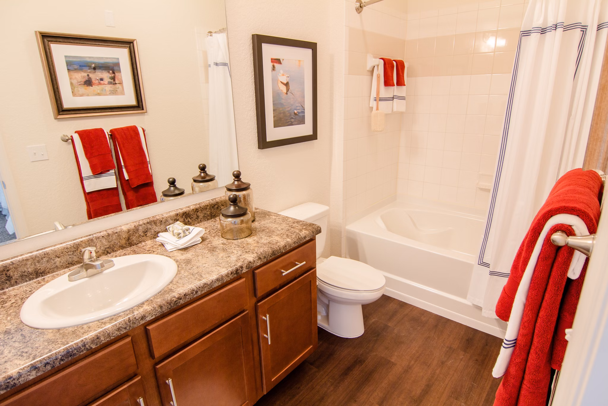Bathroom featuring sleek fixtures and marble tiles at The Vineyards at Hammock Ridge Apartments
