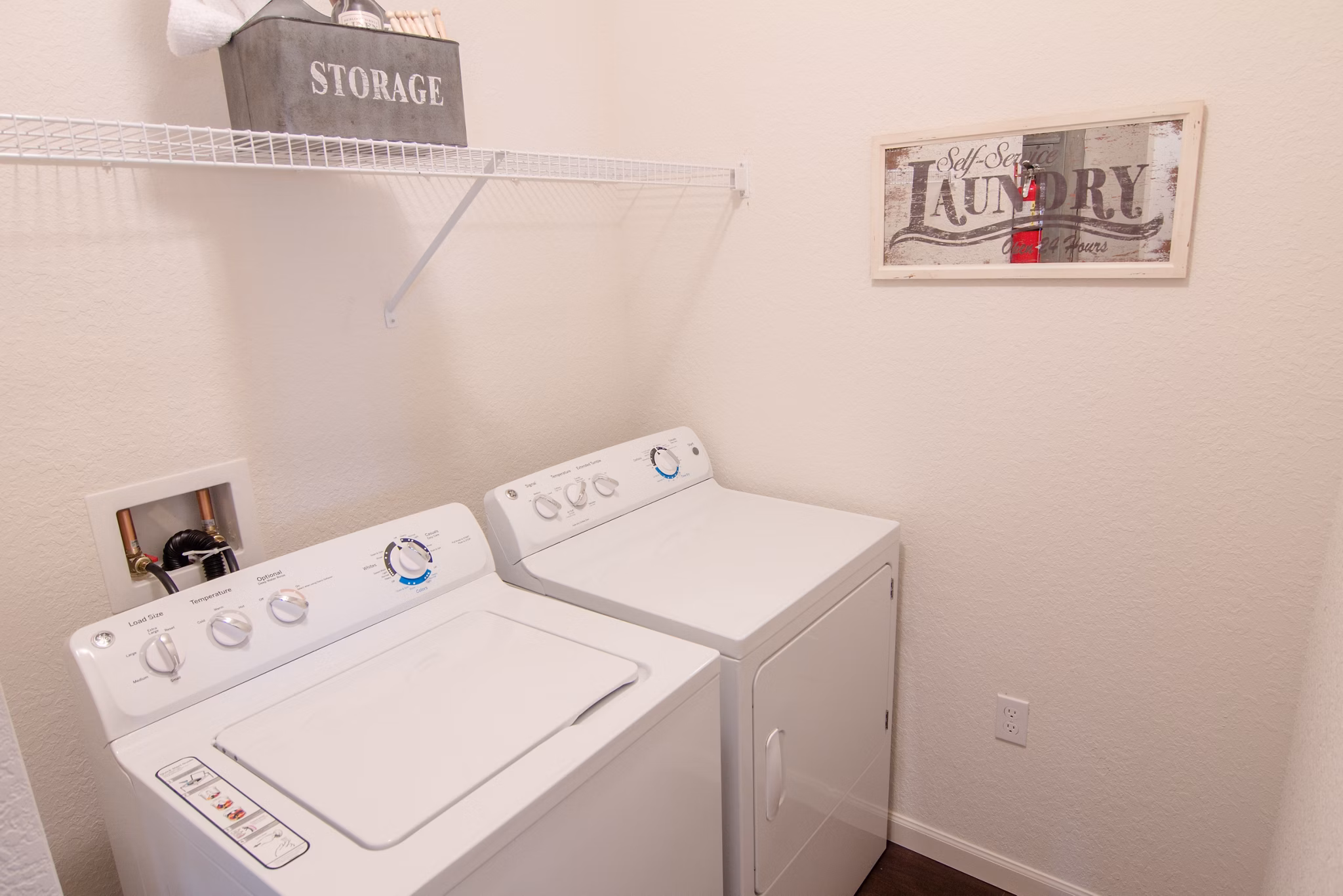 Laundry room with modern appliances at The Vineyards at Hammock Ridge Apartments: Spacious and efficient design for convenient living
