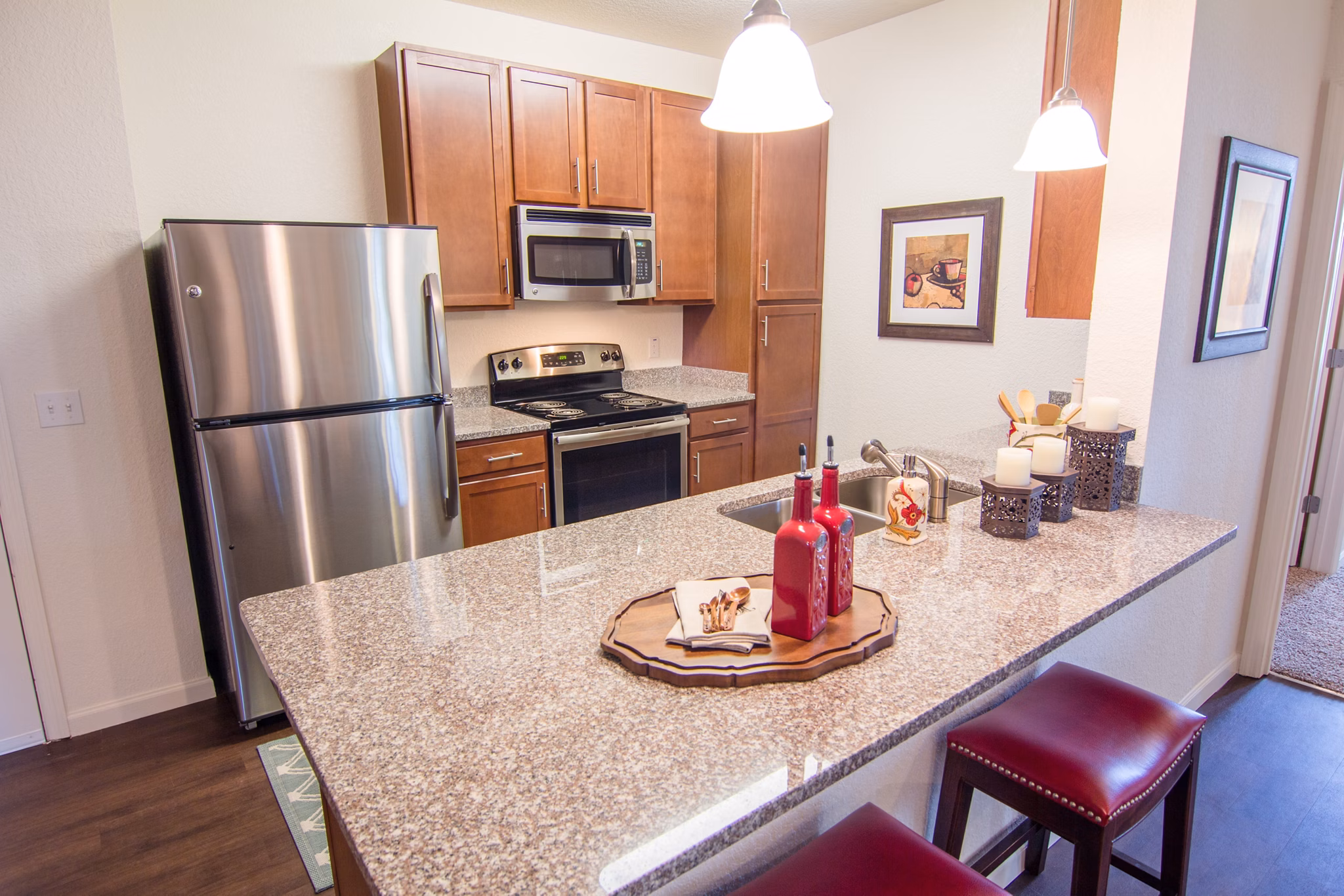 Modern kitchen with stainless steel appliances at The Vineyards at Hammock Ridge Apartments