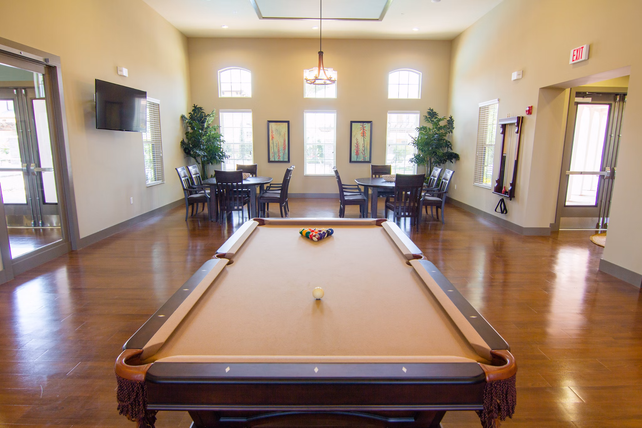 Game room with pool table and arcade games at The Vineyards at Hammock Ridge Apartments