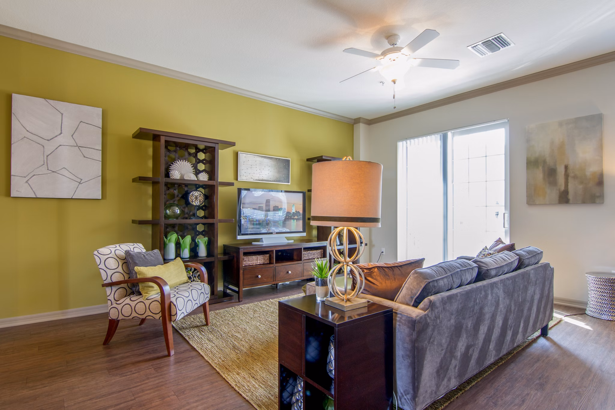 Spacious living room with modern decor and natural light at Midtown Delray Apartments in Delray Beach