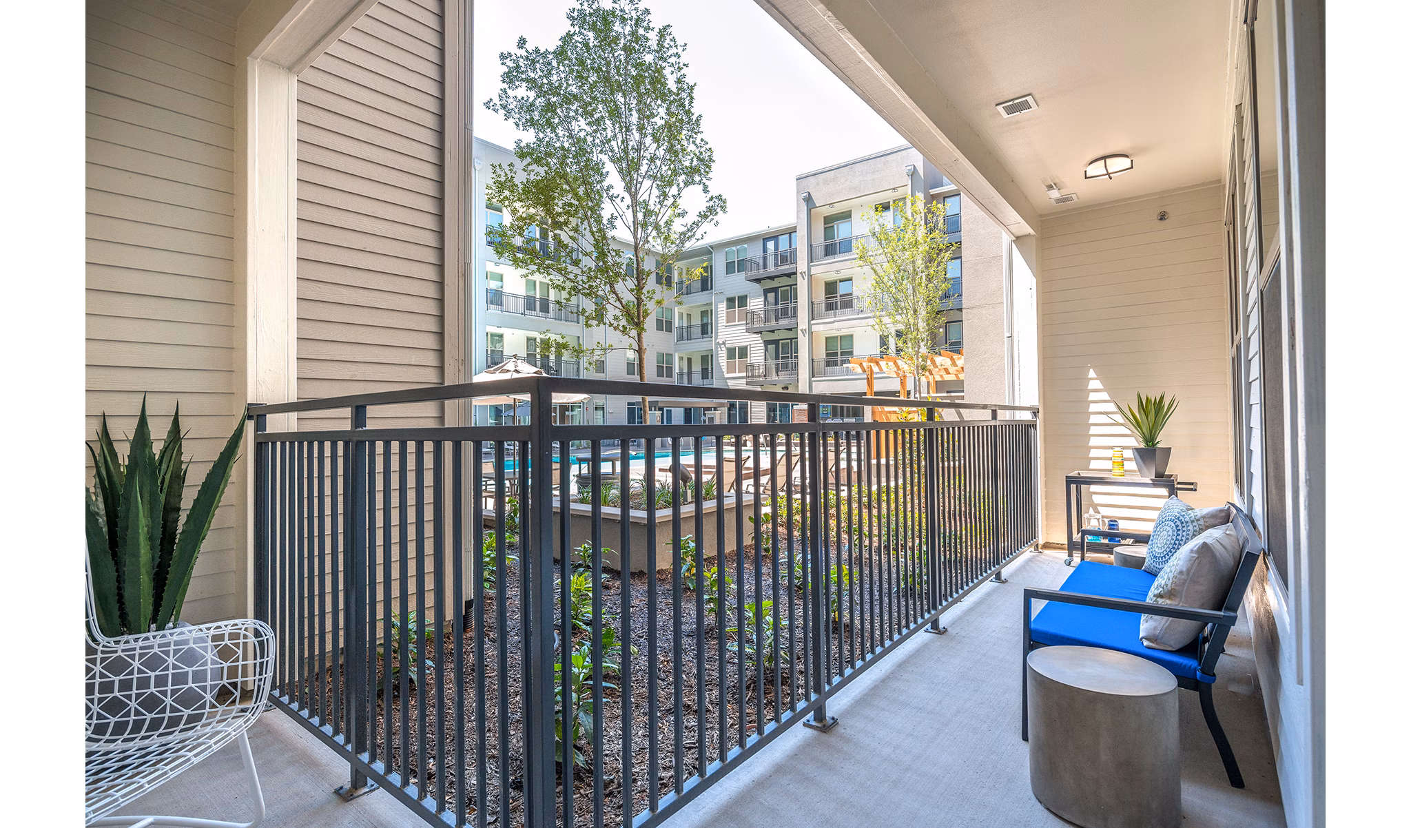 Private balcony with modern seating at Overture Plano Apartments