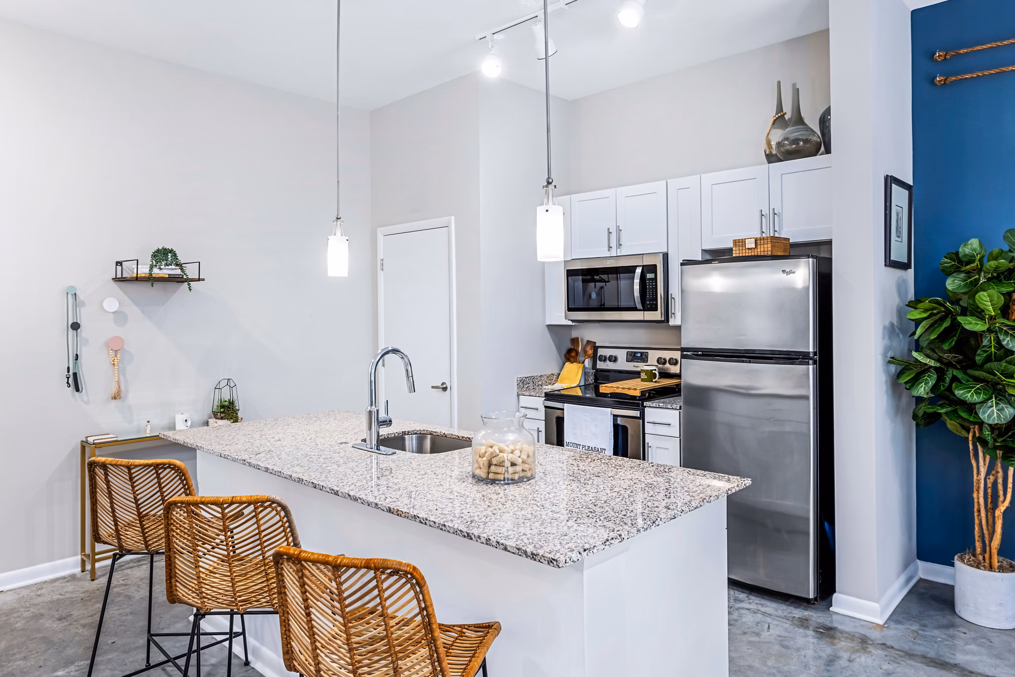 Modern kitchen with stainless steel appliances in Riviera at Seaside Apartments