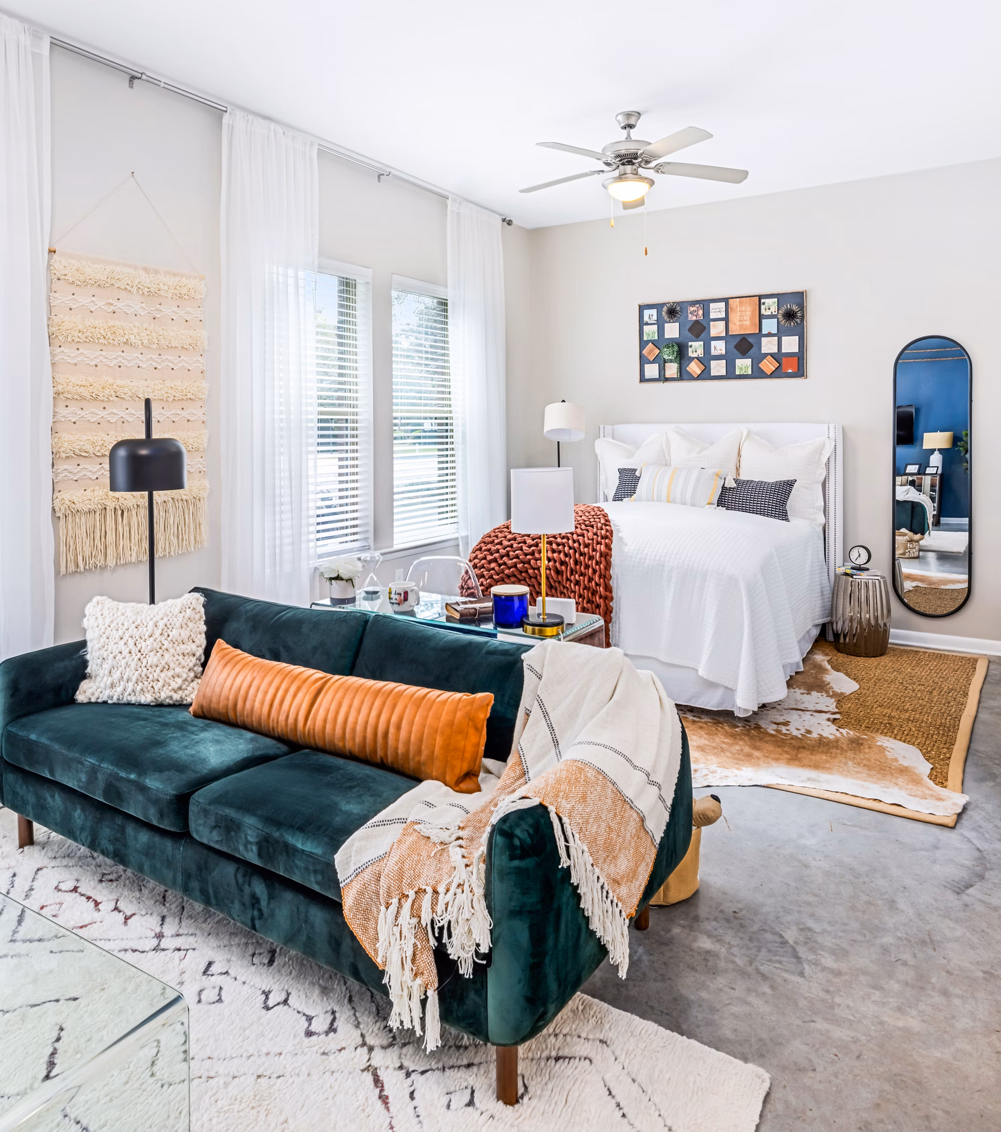 Cozy studio living and bedroom with modern decor at Riviera at Seaside Apartments, luxury living near the beach