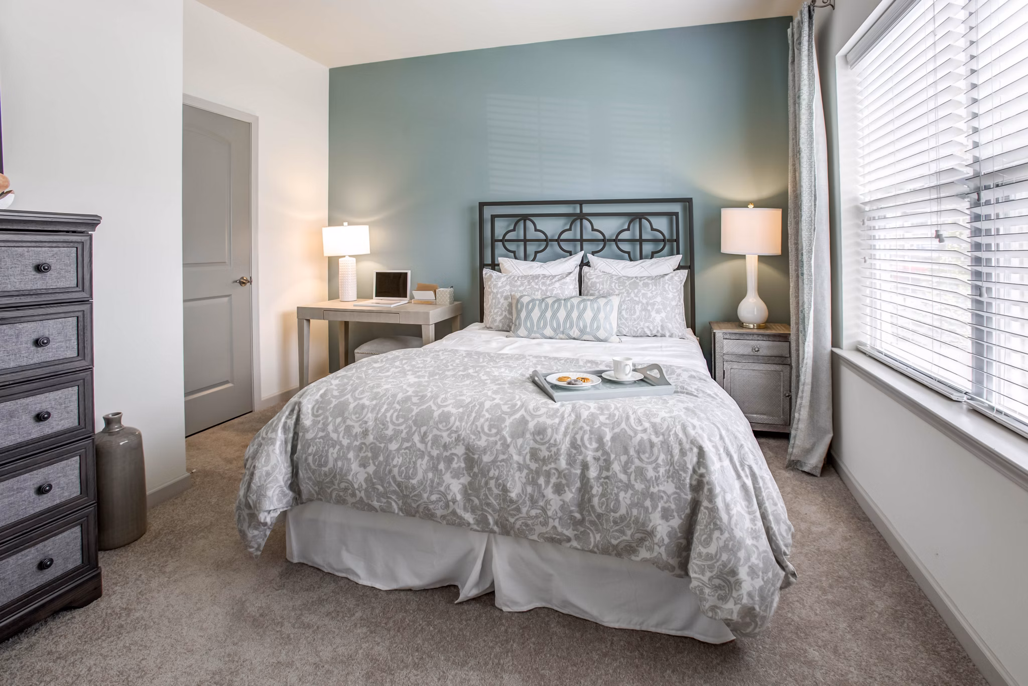 Bedroom featuring modern design elements at The Reserve at the Boulevard Apartments