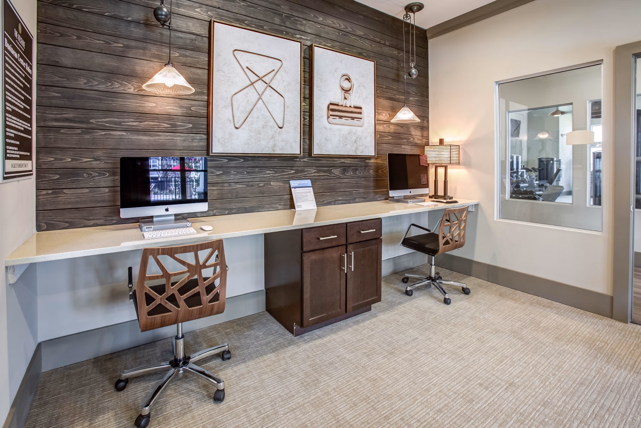Business center with modern workstations at The Reserve at the Boulevard Apartments, an upscale Greystar luxury apartment community