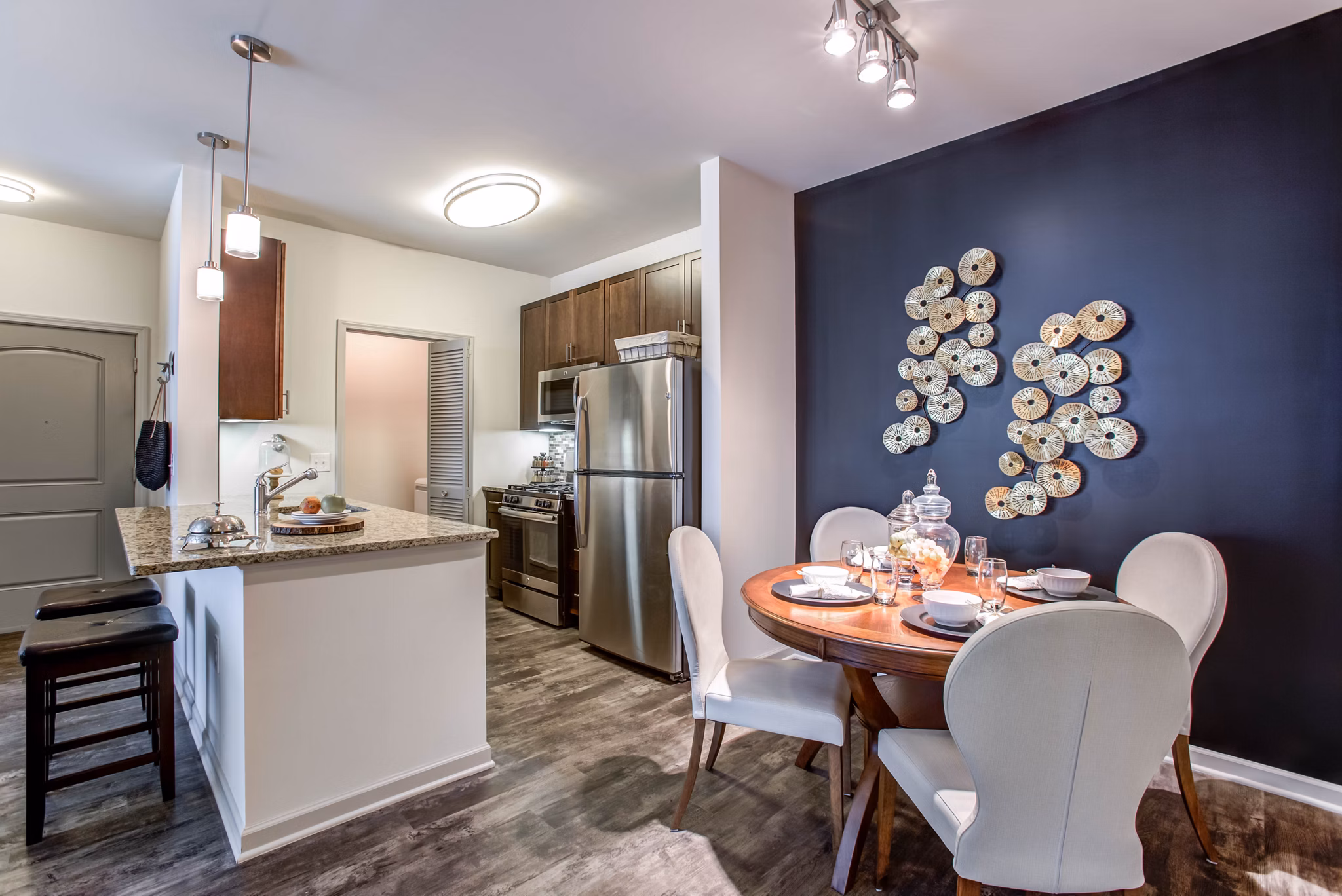 Chic dining room with elegant lighting at The Reserve at the Boulevard Apartments
