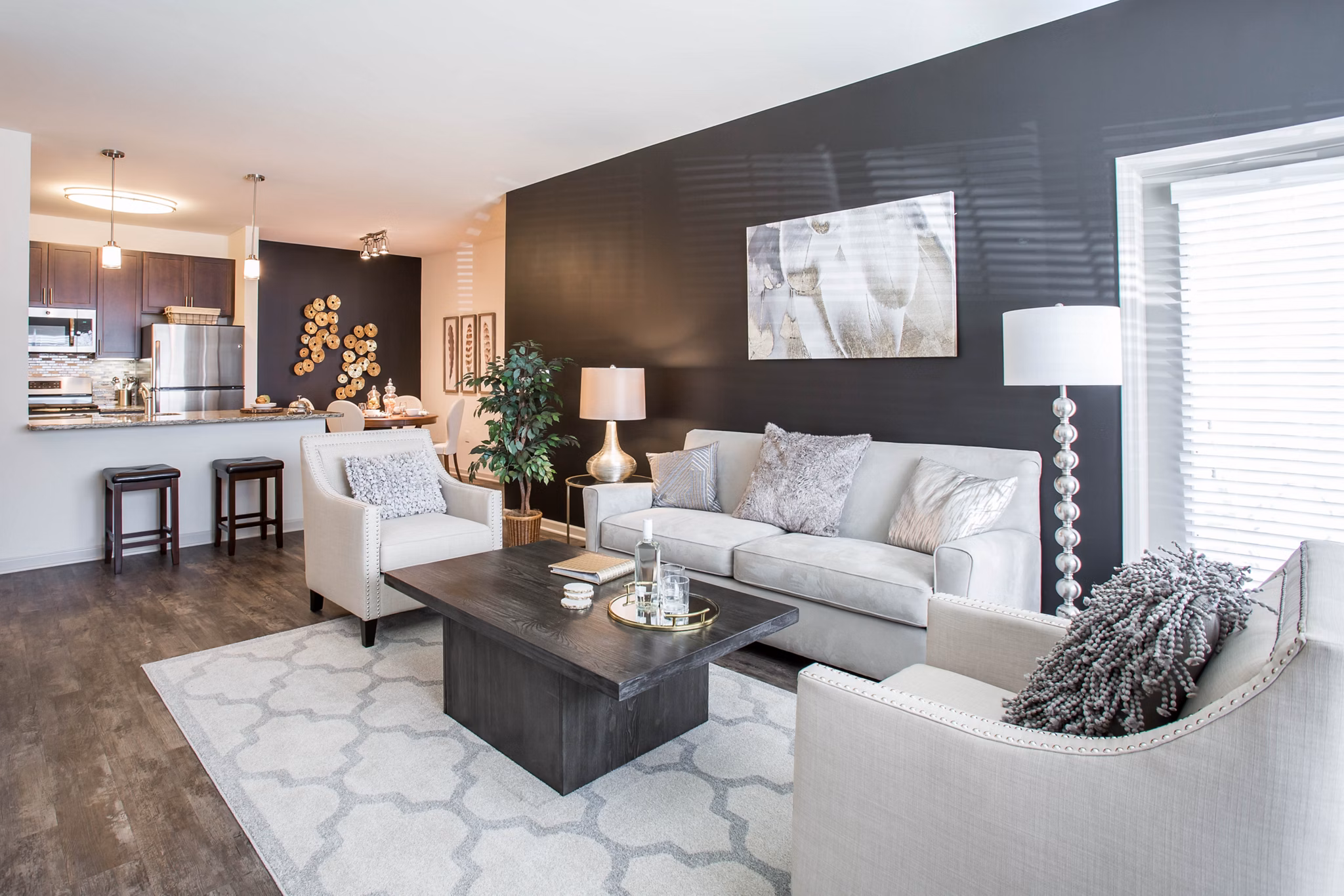 Spacious living room with stylish decor and modern furnishings at The Reserve at the Boulevard Apartments