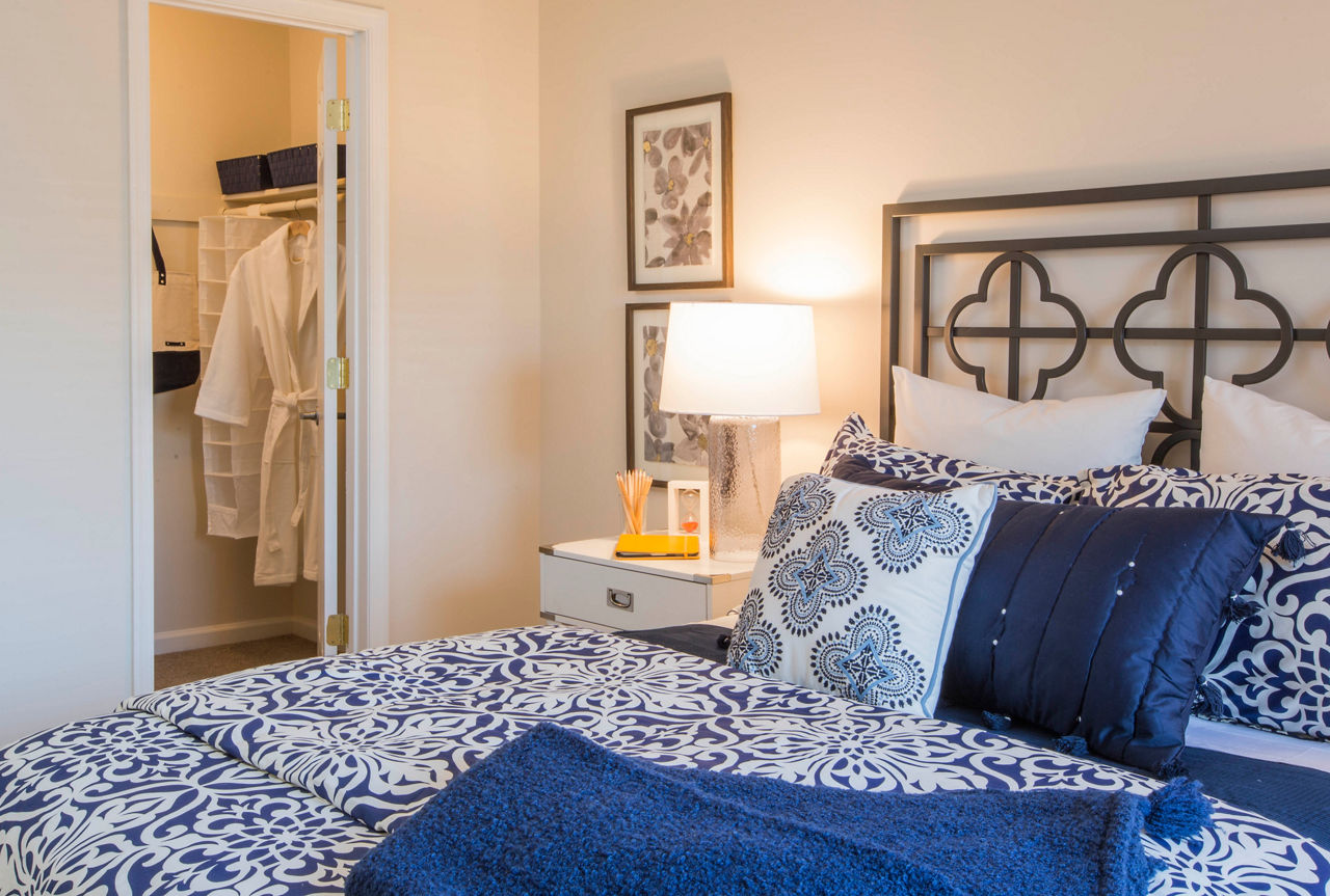 Cozy bedroom with natural light in Bayshore Landing Apartments