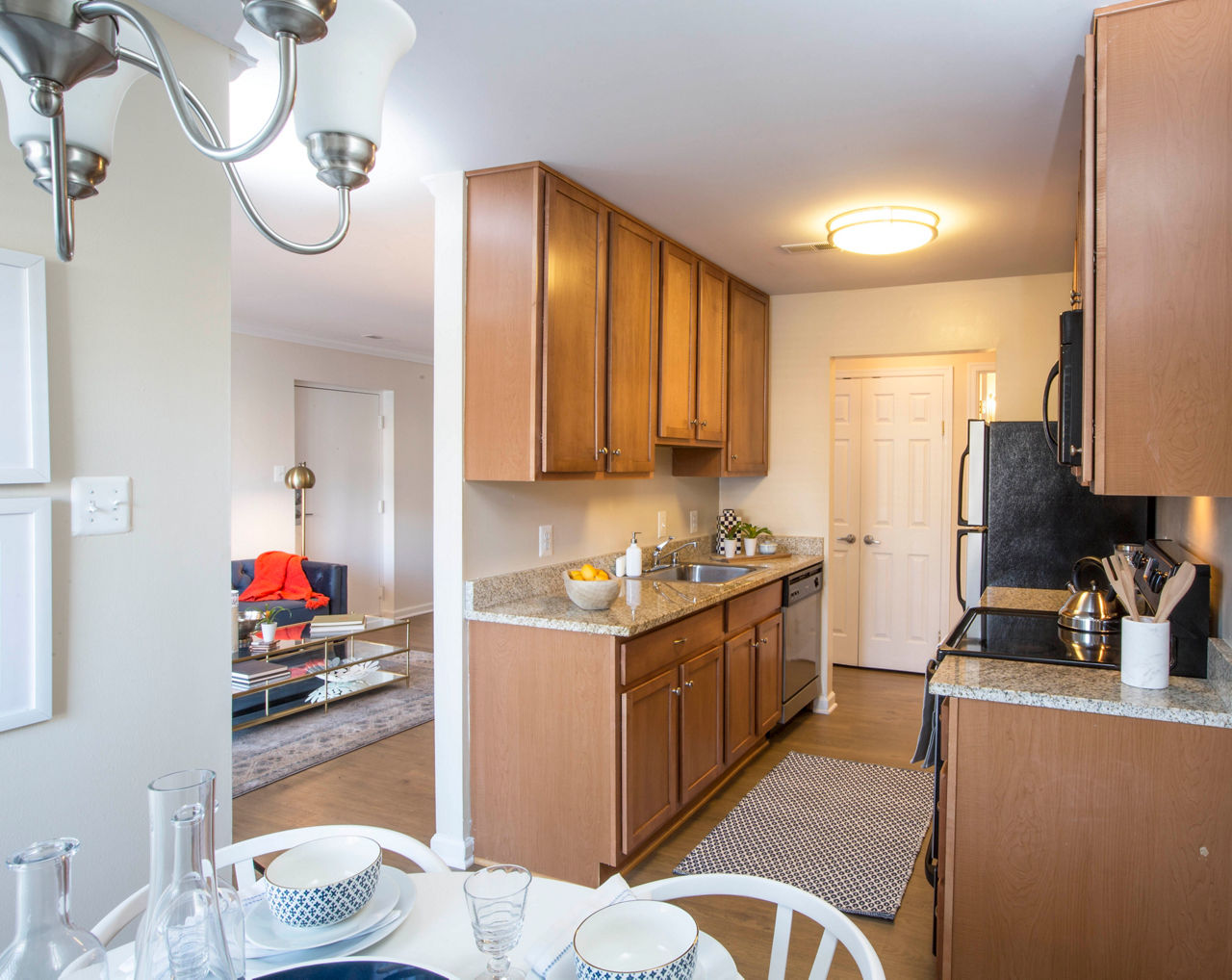 Kitchen with modern appliances and granite countertops at Bayshore Landing Apartments, Greystar luxury apartments