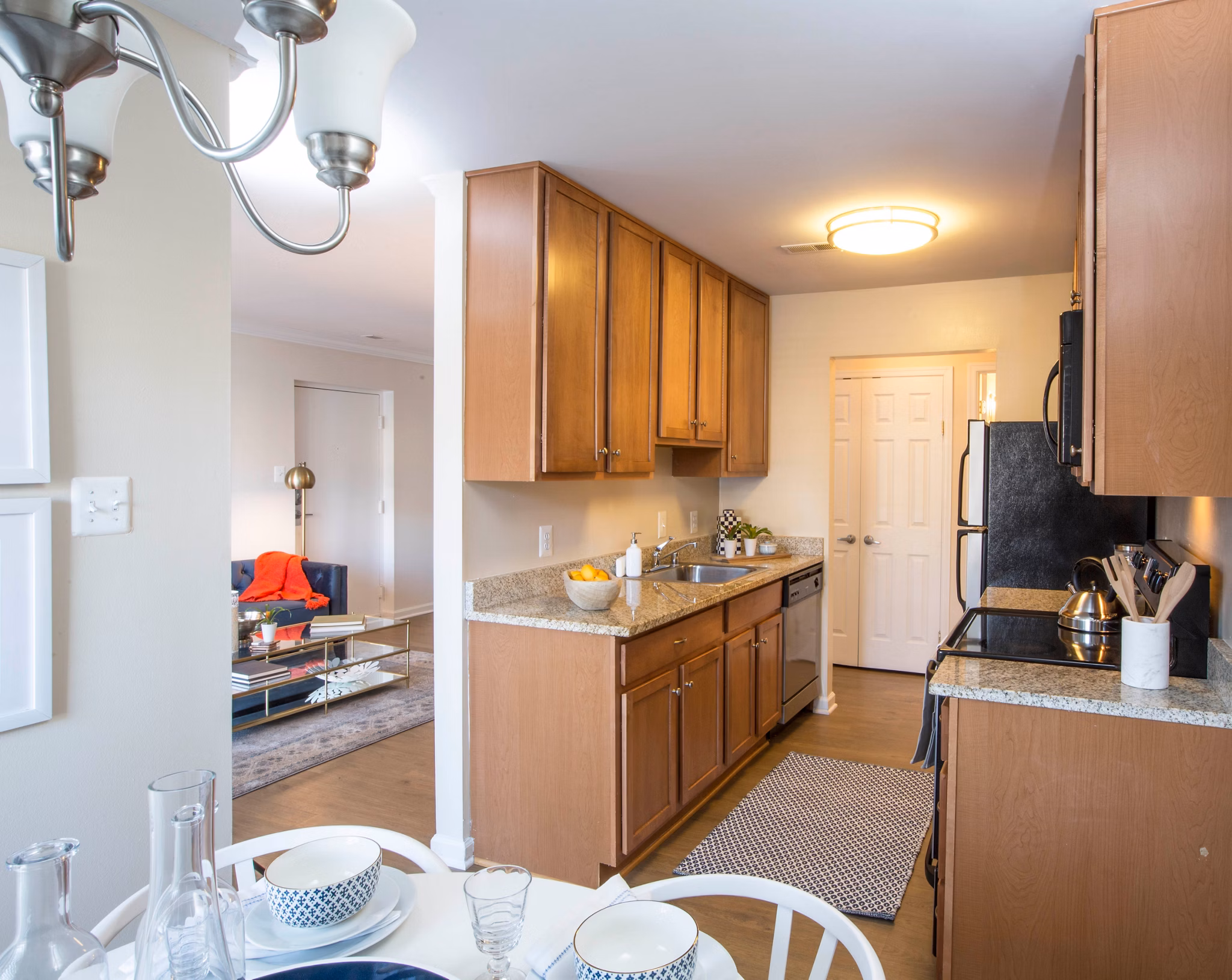 Kitchen with modern appliances and granite countertops at Bayshore Landing Apartments, Greystar luxury apartments