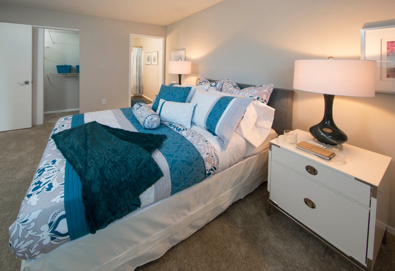 Cozy bedroom with natural light at Southfield Apartments, a luxury living space with modern amenities