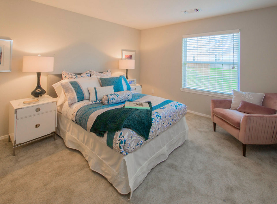 Cozy bedroom with modern decor at Southfield Apartments, luxury living by Greystar