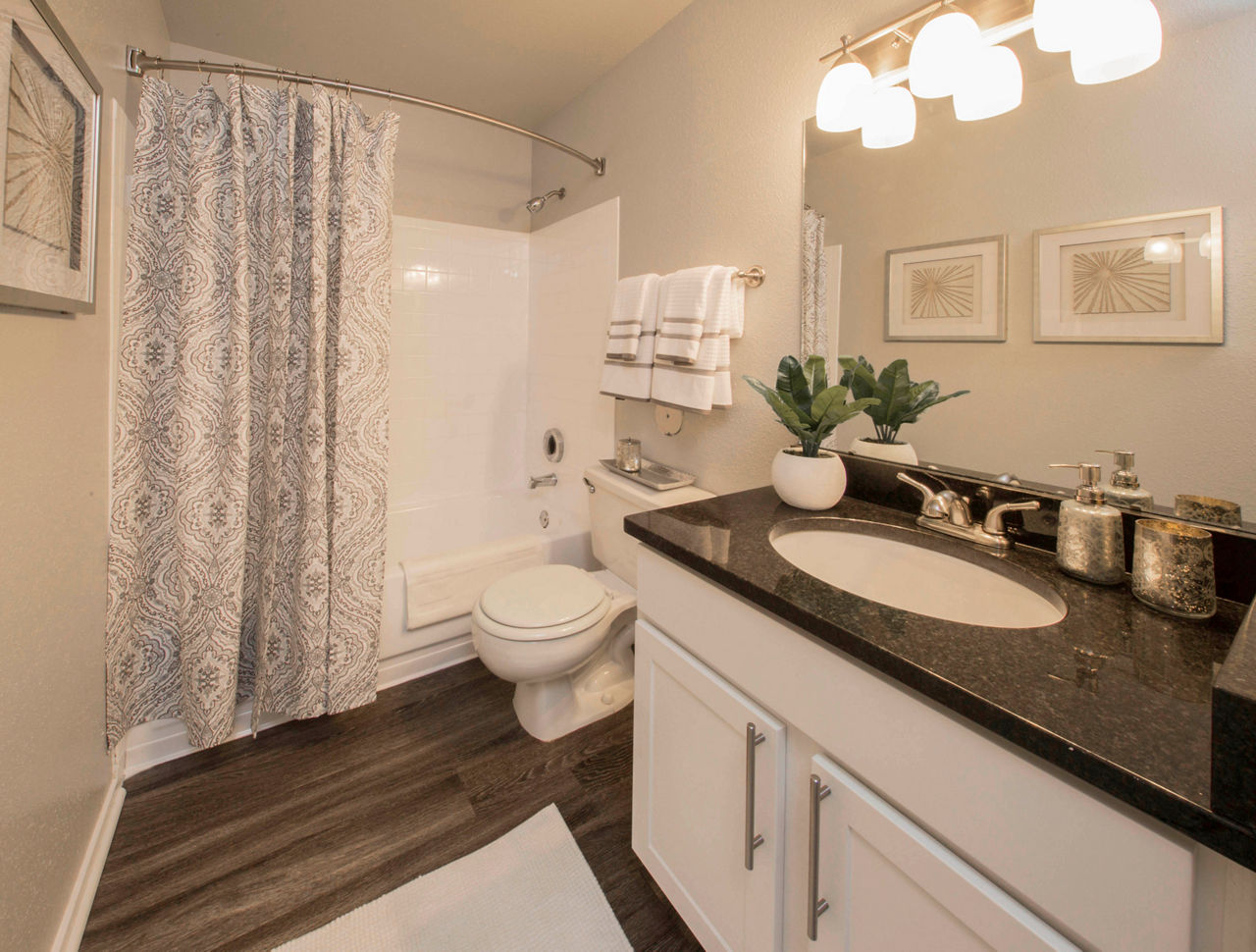 Bathroom with sleek fixtures and granite countertops in Southfield Apartments