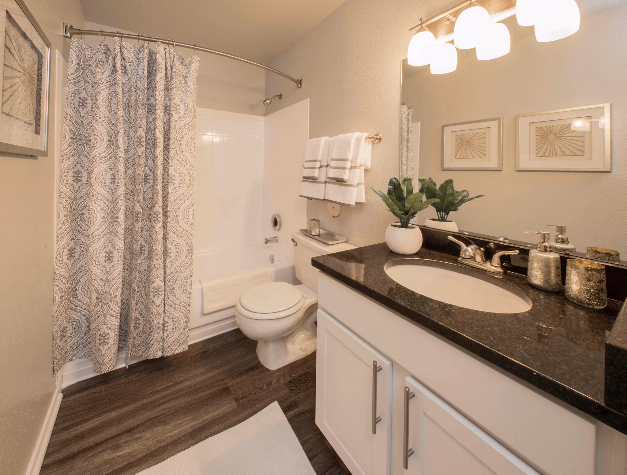 Bathroom with sleek fixtures and granite countertops in Southfield Apartments