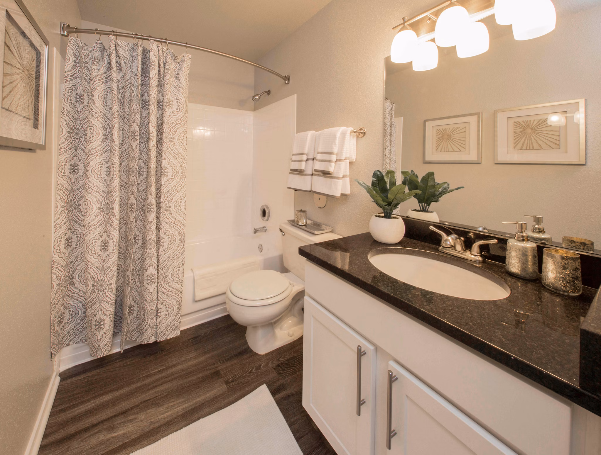 Bathroom with sleek fixtures and granite countertops in Southfield Apartments