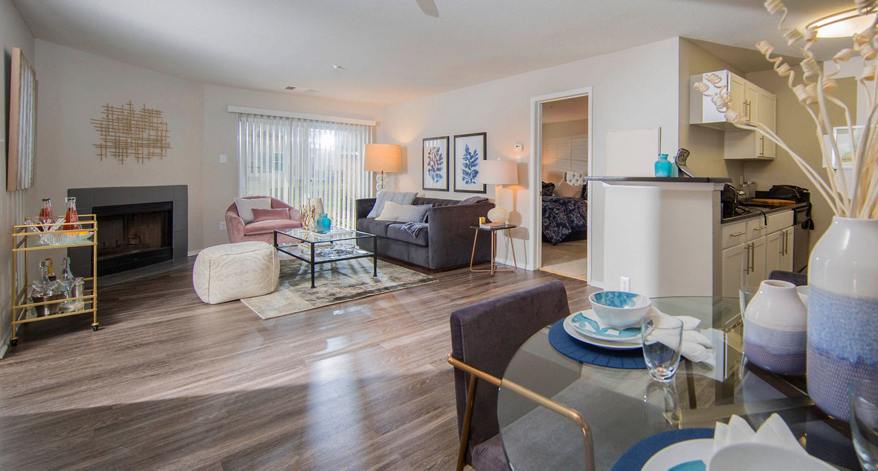 Spacious living room with modern decor in Southfield Apartments