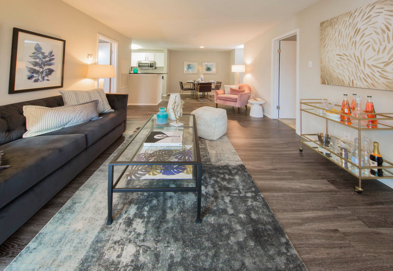 Spacious living area with modern furnishings at Southfield Apartments, featuring a sunlit atmosphere