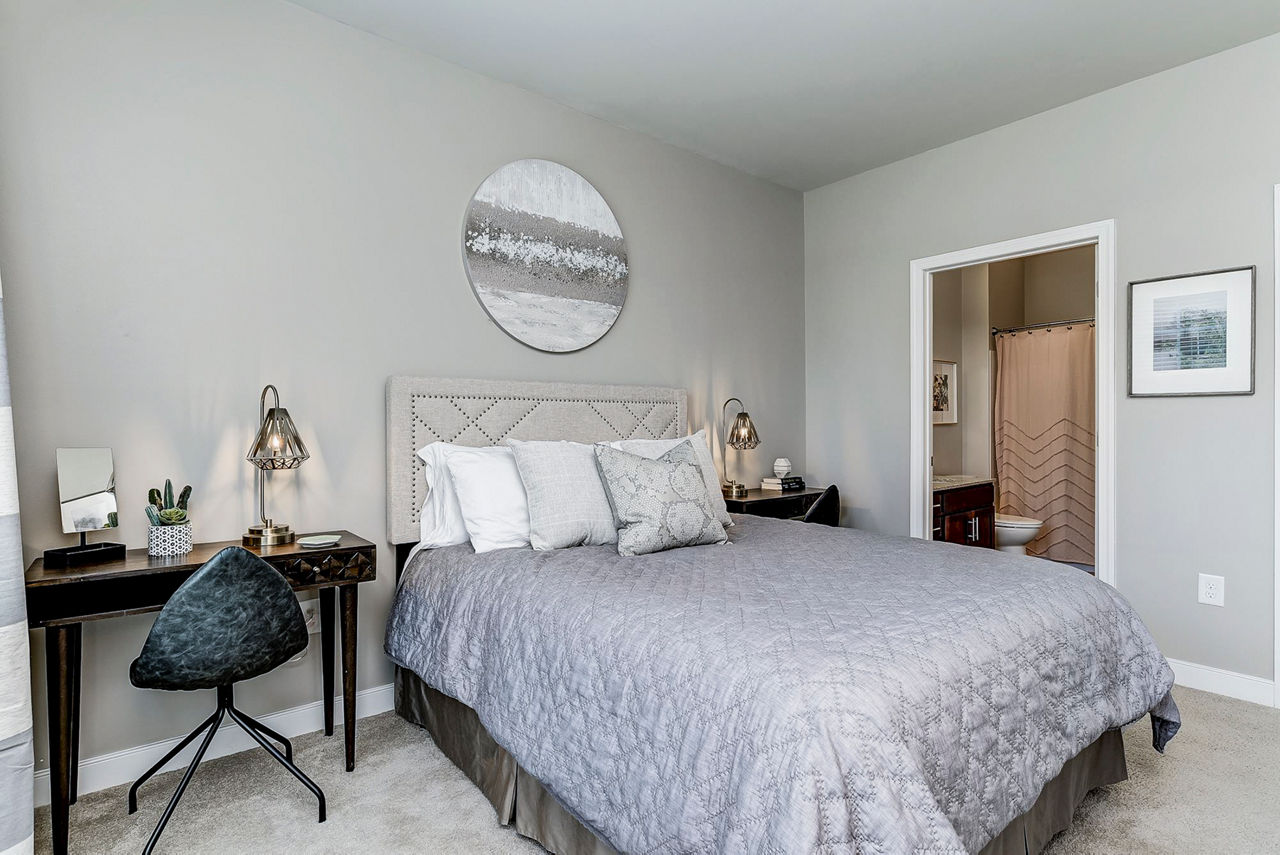 Cozy bedroom with modern decor at Paragon at Columbia Overlook Apartments
