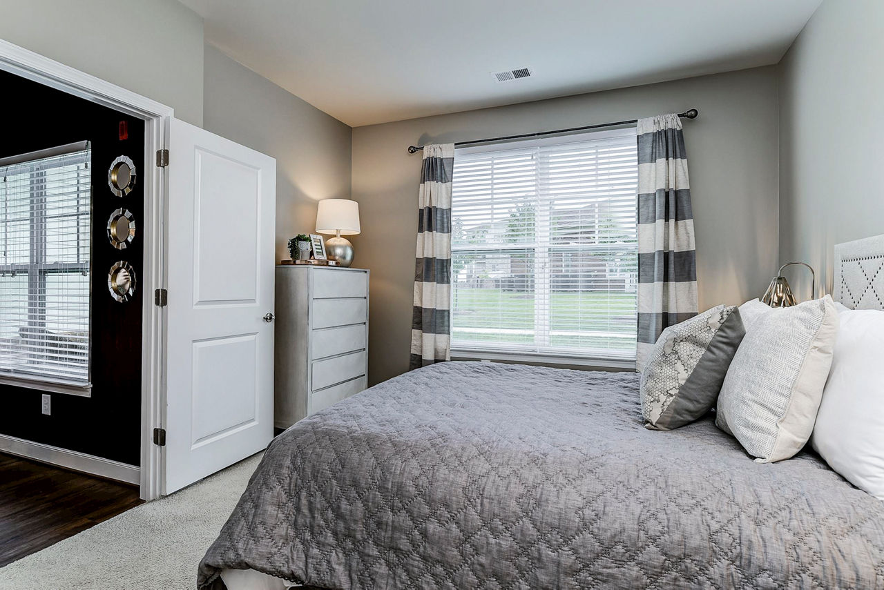 Spacious bedroom with modern decor at Paragon at Columbia Overlook Apartments, offering comfort and style in optimal luxury living spaces