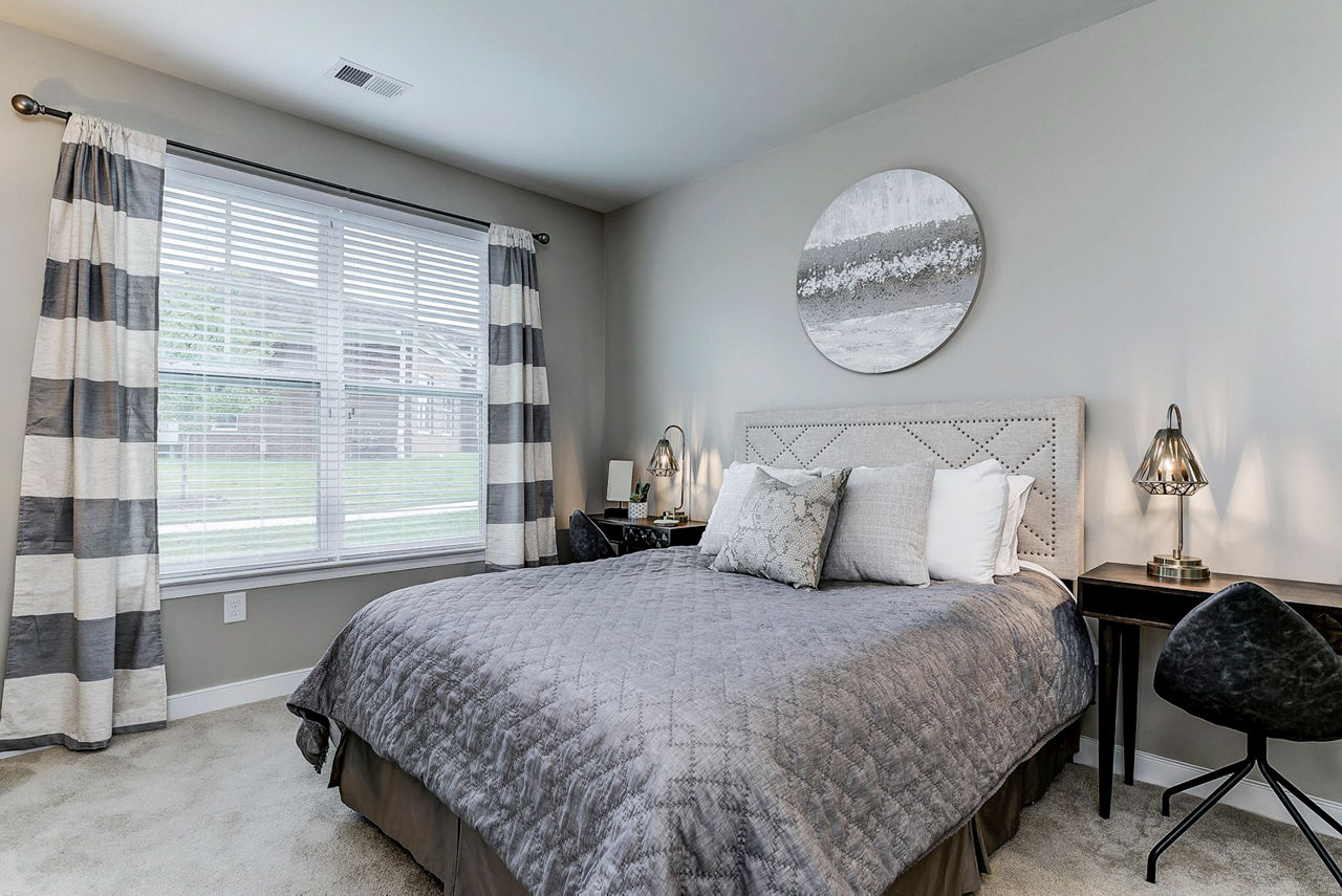 Bedroom featuring modern decor and ample natural light at Paragon at Columbia Overlook Apartments