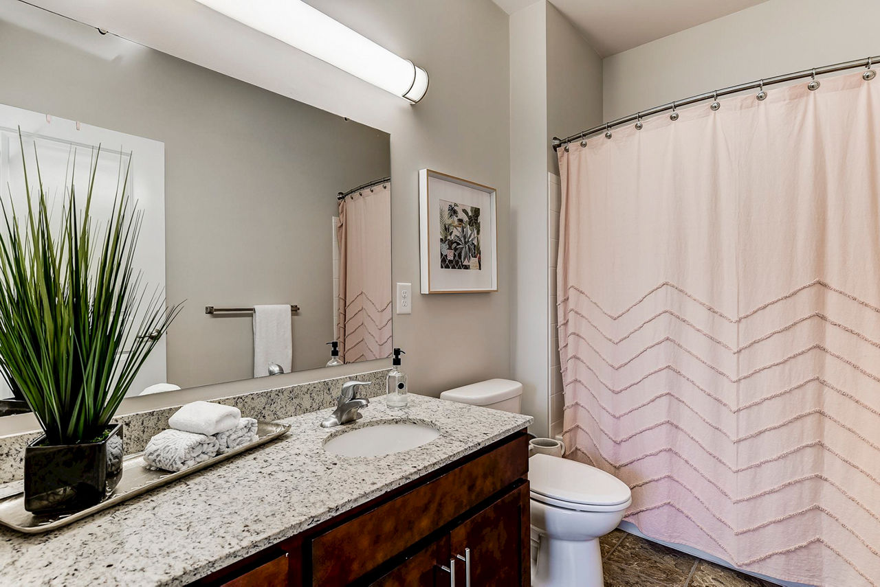 Modern bathroom featuring sleek fixtures at Paragon at Columbia Overlook Apartments