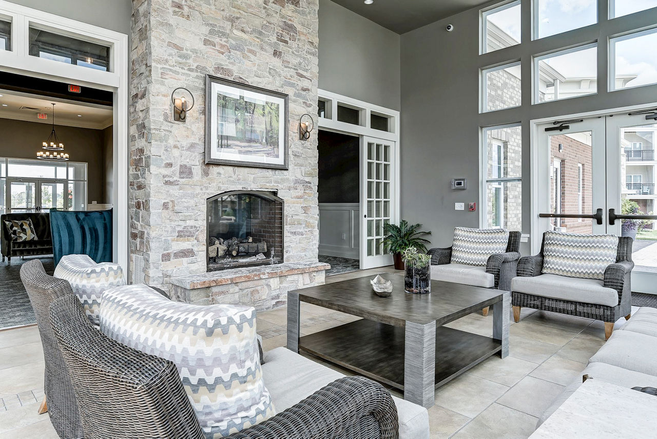Clubhouse with contemporary design and seating areas at Paragon at Columbia Overlook Apartments, ideal for resident gatherings and events