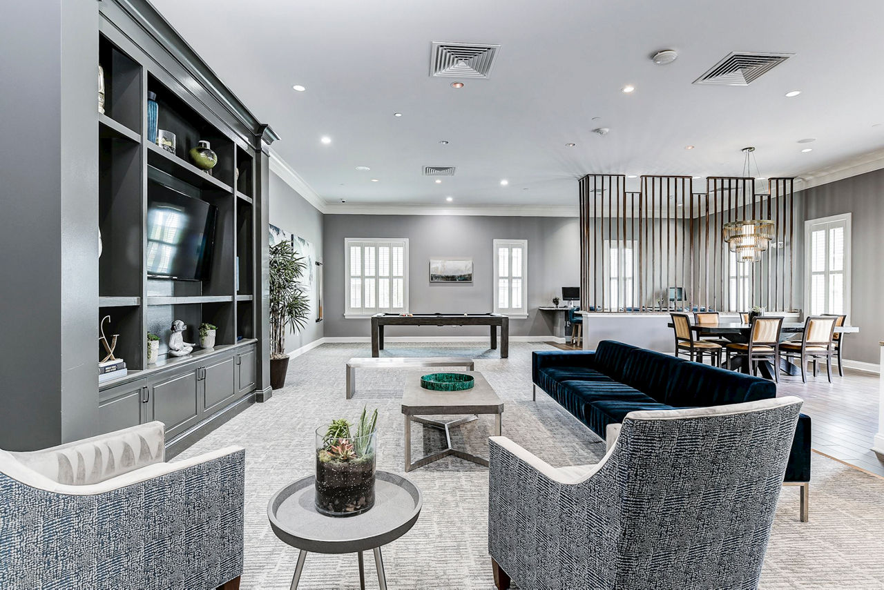 Colorful game room with pool table and arcade games at Paragon at Columbia Overlook Apartments