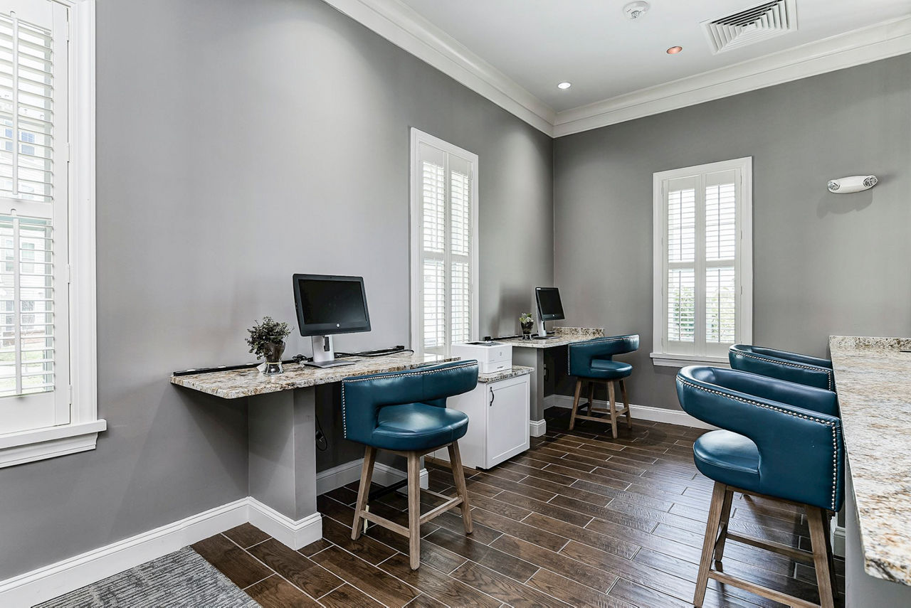 Business center with modern workstations at Paragon at Columbia Overlook Apartments, a Greystar luxury community