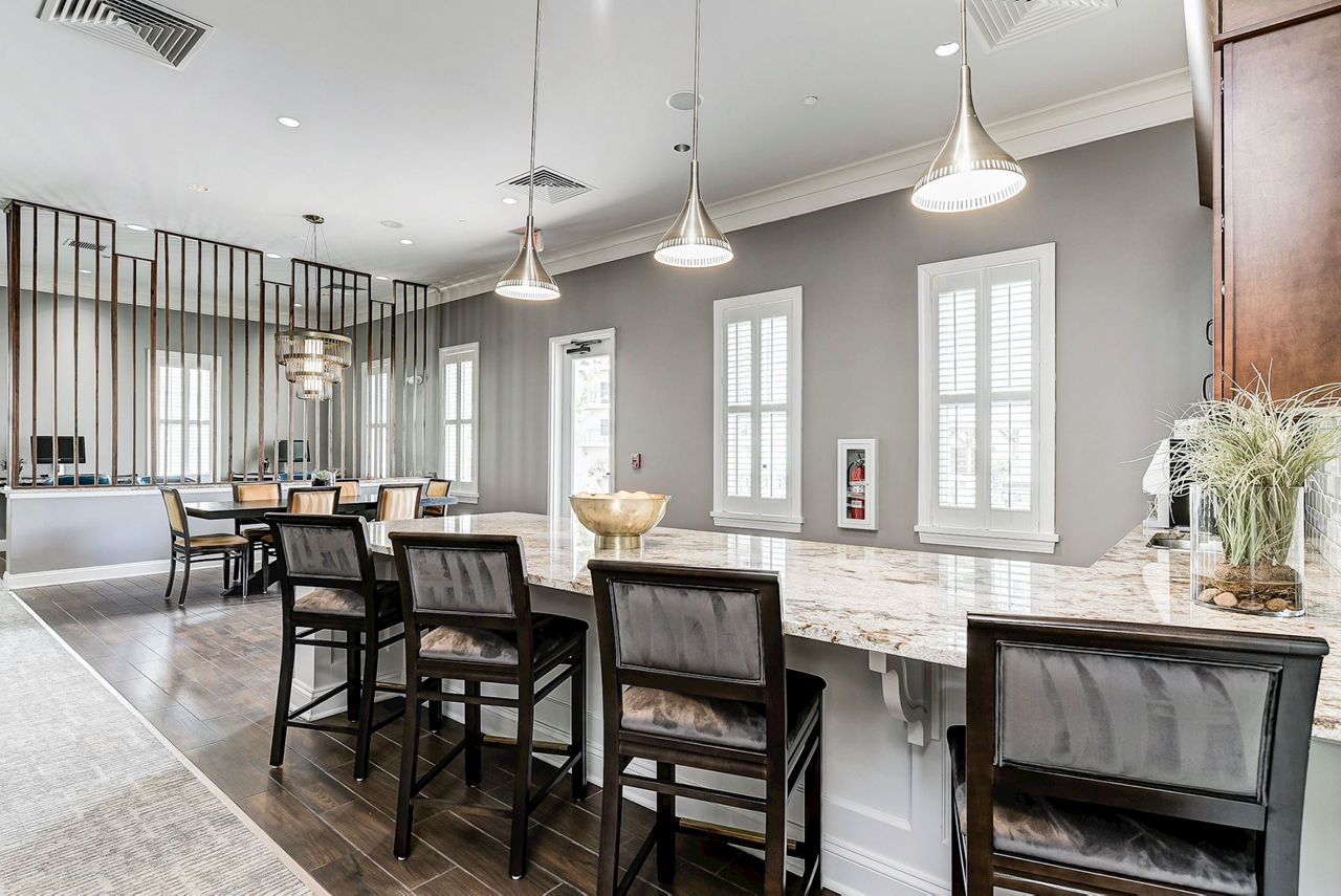 Elegant clubhouse with cozy seating and modern decor at Paragon at Columbia Overlook Apartments