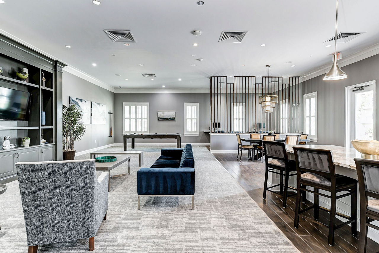 Modern clubhouse with stylish seating at Paragon at Columbia Overlook Apartments, offering luxury amenities and a vibrant community atmosphere