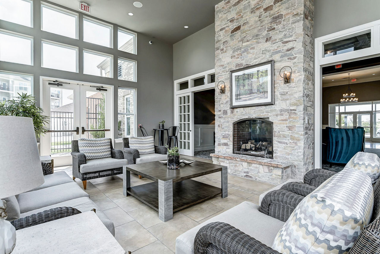 Clubhouse featuring modern furnishings and spacious seating at Paragon at Columbia Overlook Apartments