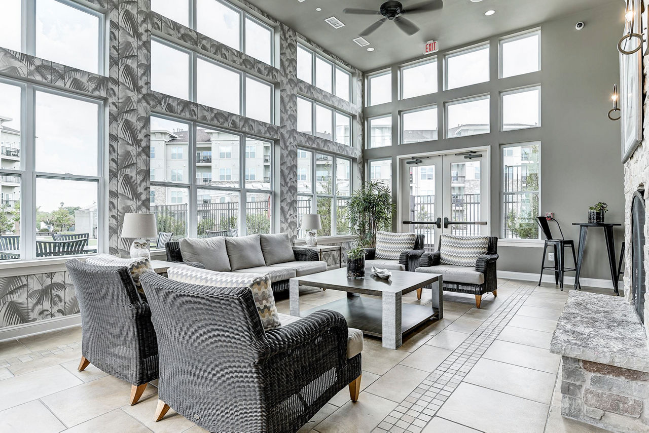 Clubhouse with modern design and ample seating at Paragon at Columbia Overlook Apartments