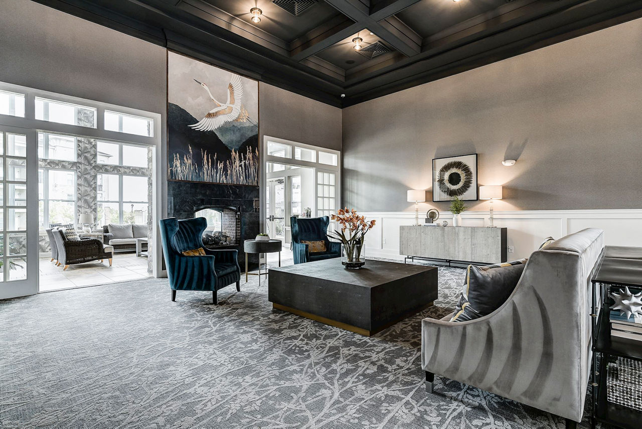 Clubhouse featuring modern design and comfortable seating at Paragon at Columbia Overlook Apartments