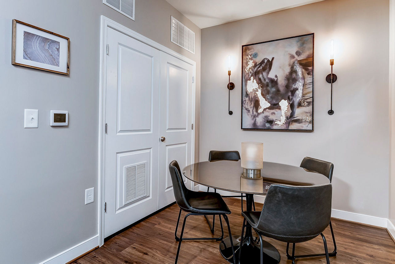 Dining room featuring elegant lighting and modern decor in Paragon at Columbia Overlook Apartments